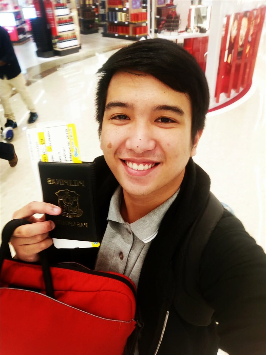 Jeremy holding his Philippine passport
